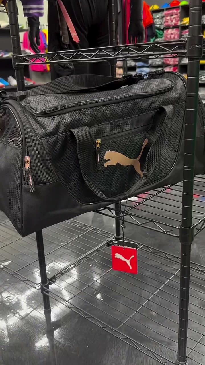 Puma duffle bag on a rack at Xpress Sports